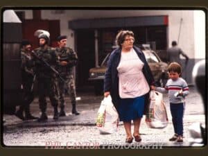 Grandmother shopping with British soldiers, Belfast, NI 1984