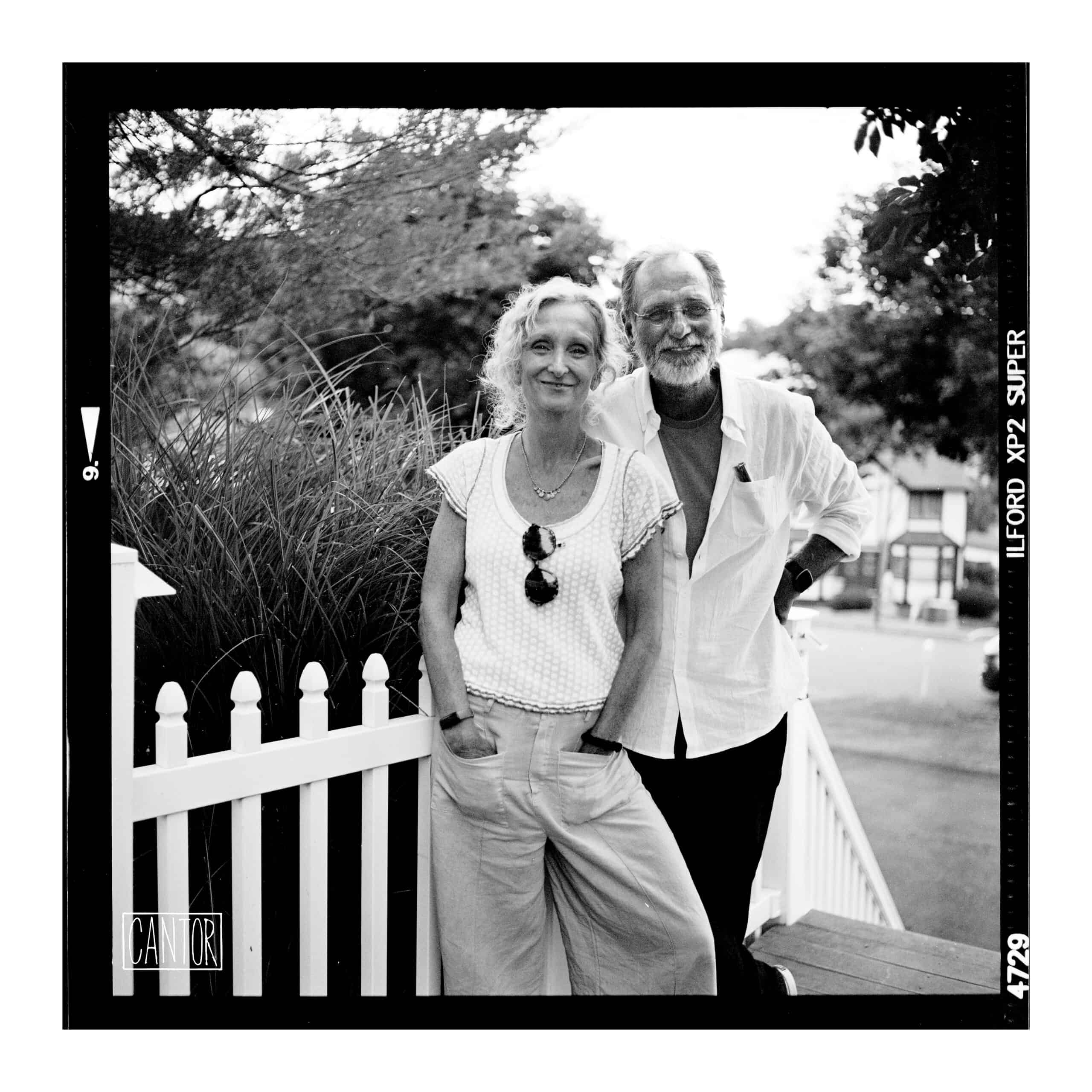 Friendly couple with fence in Rockland County. Photo by Phil Cantor