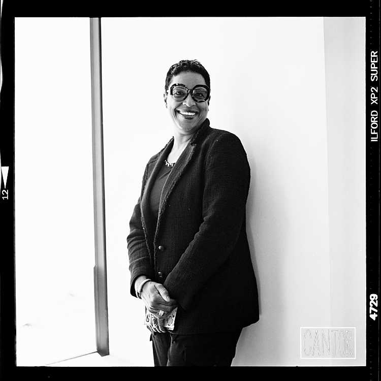 Store Associate in furniture showroom photographed with Rolleiflex by Phil Cantor Photography